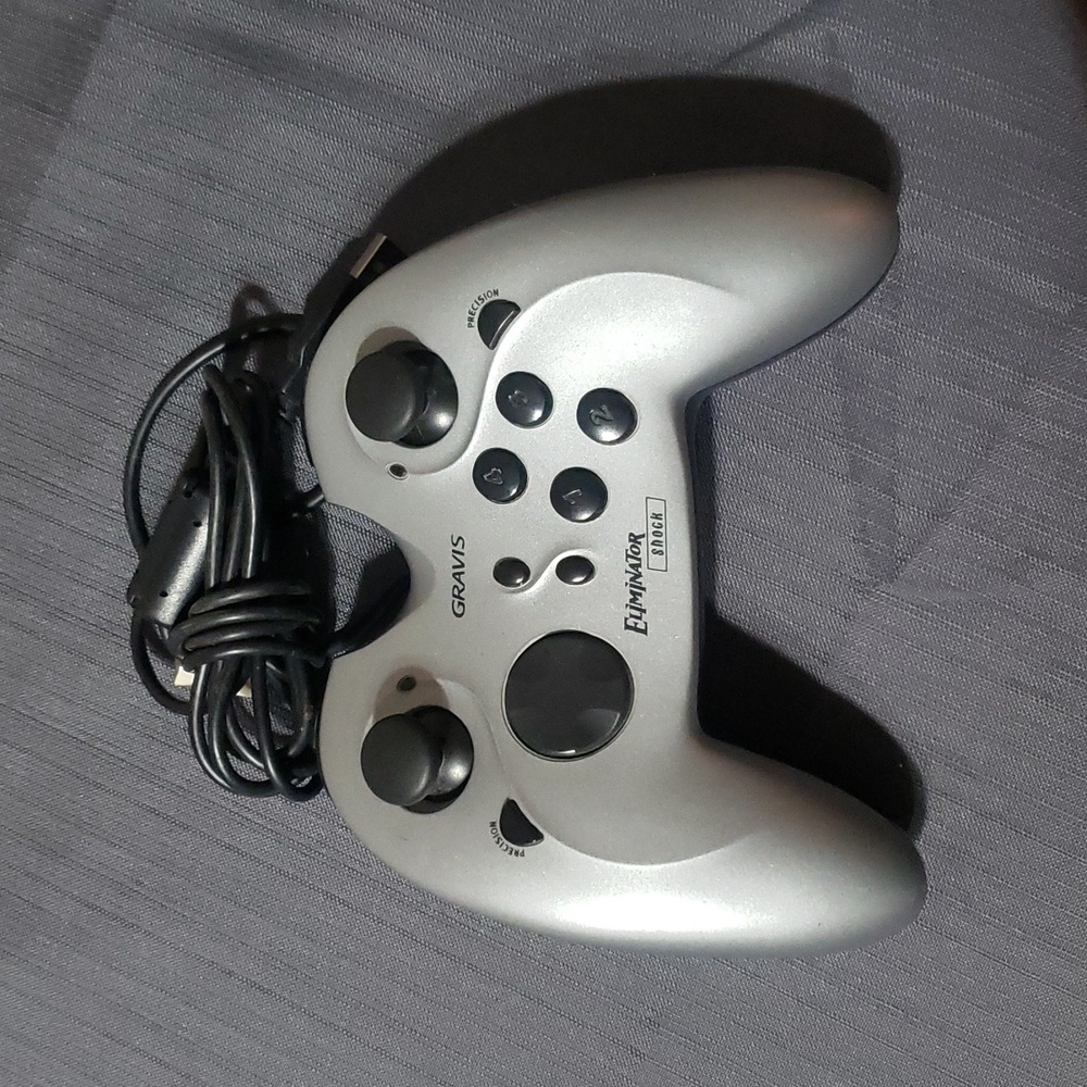 Gravis Eliminator Aftershock Controller USB is a game pad designed for PC games.